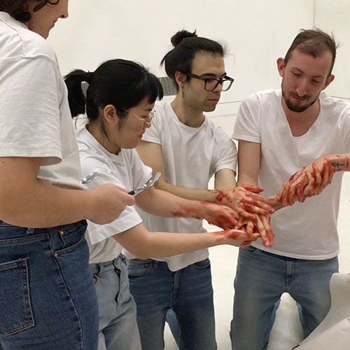 Factory workers hands are interlocked with jam all over them